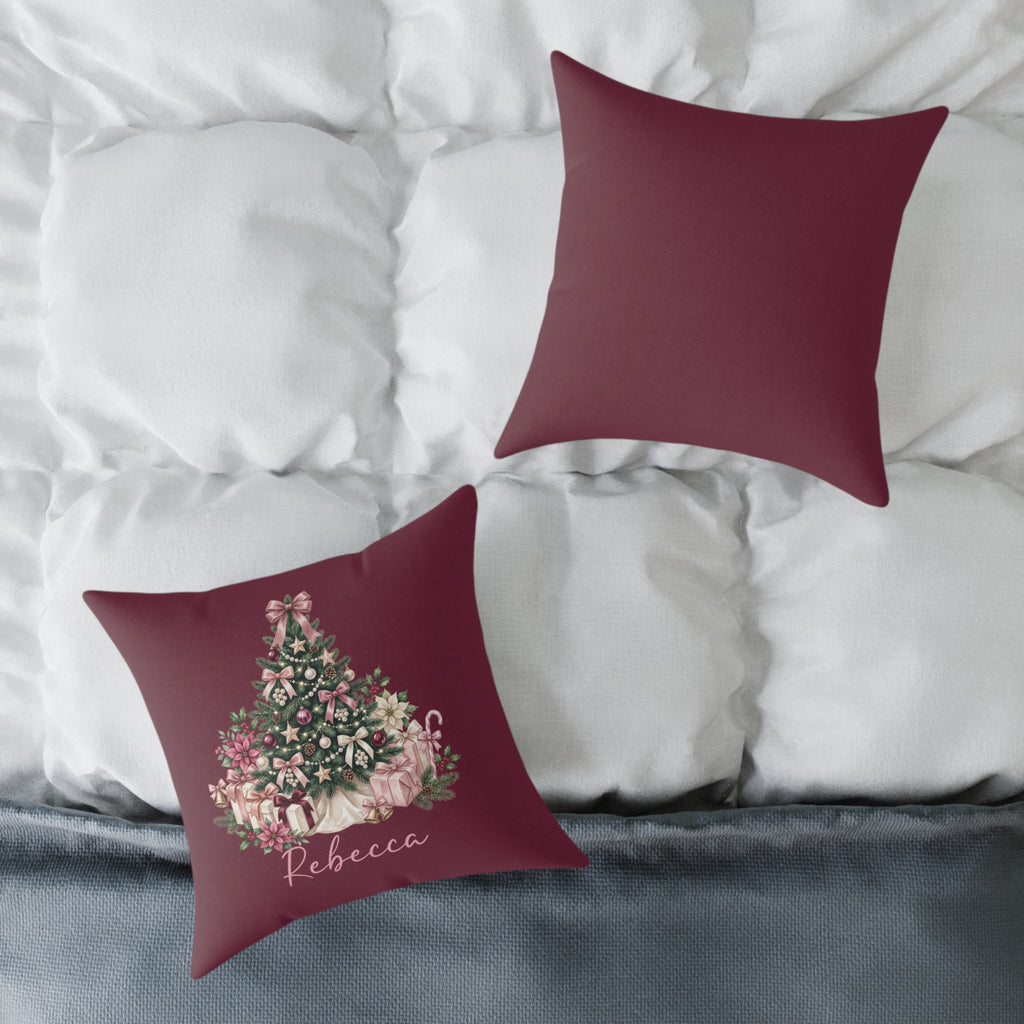 Front and back of the personalized pink gift tree name pillow on a white bed