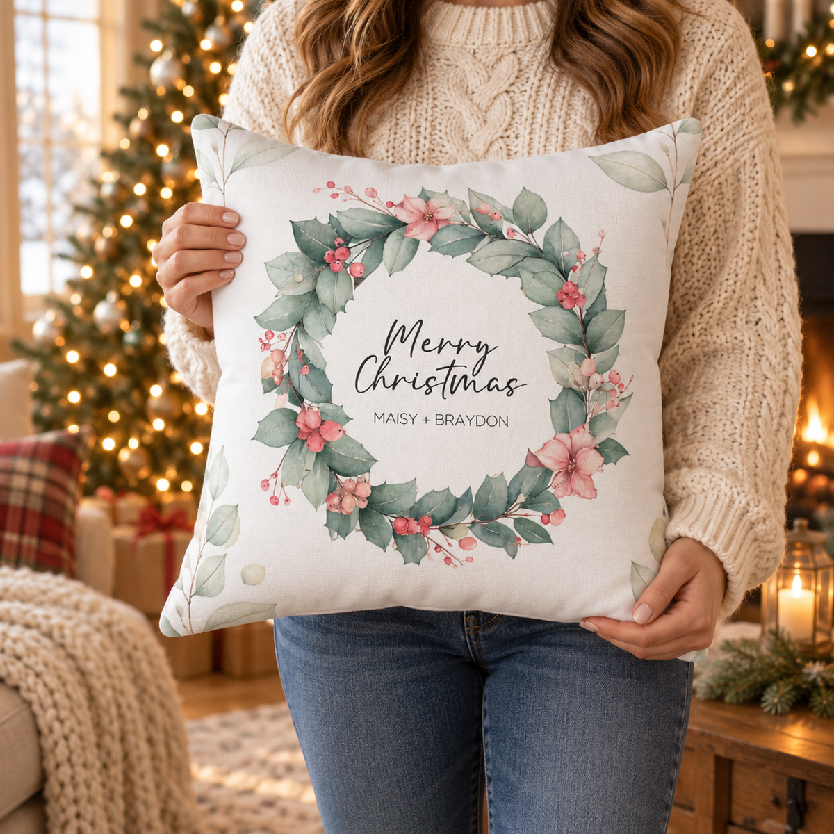 Person holding the personalized Merry Christmas eucalyptus wreath couple pillow