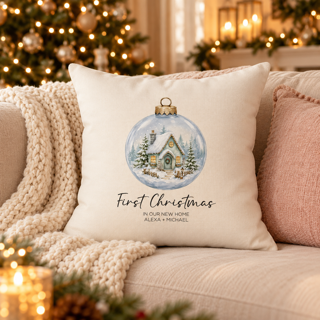 Personalized first Christmas in our new home snow globe pillow on a sofa in a Christmas living room