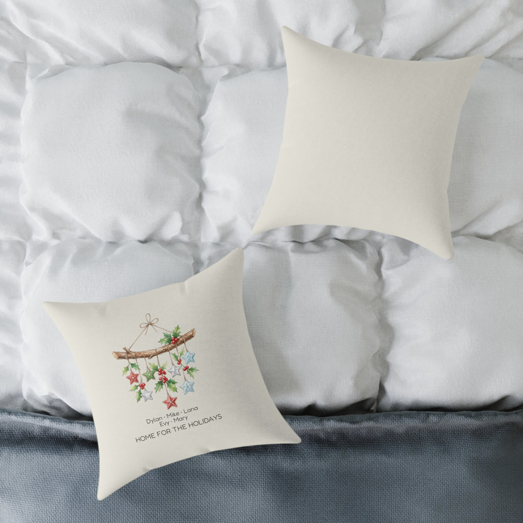 Front and back of the personalized Home for the Holidays star mobile pillow on a white bed