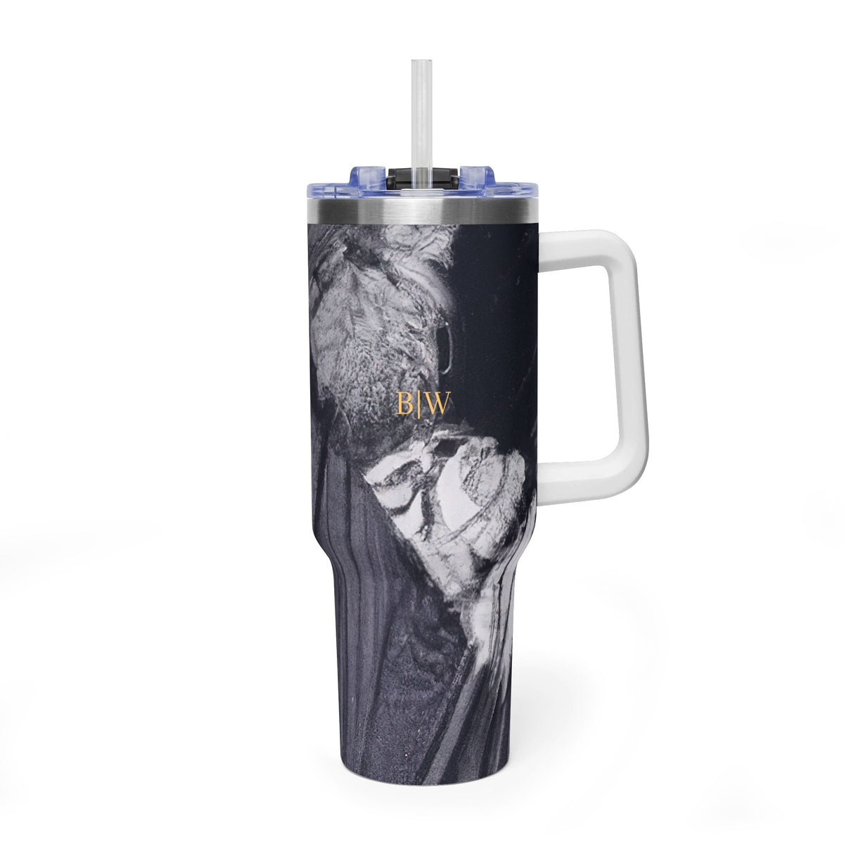 A tall handled tumbler with a clear straw and blue lid, featuring a black-and-white artistic portrait print with gold 'B|W' lettering, shown on a white background.