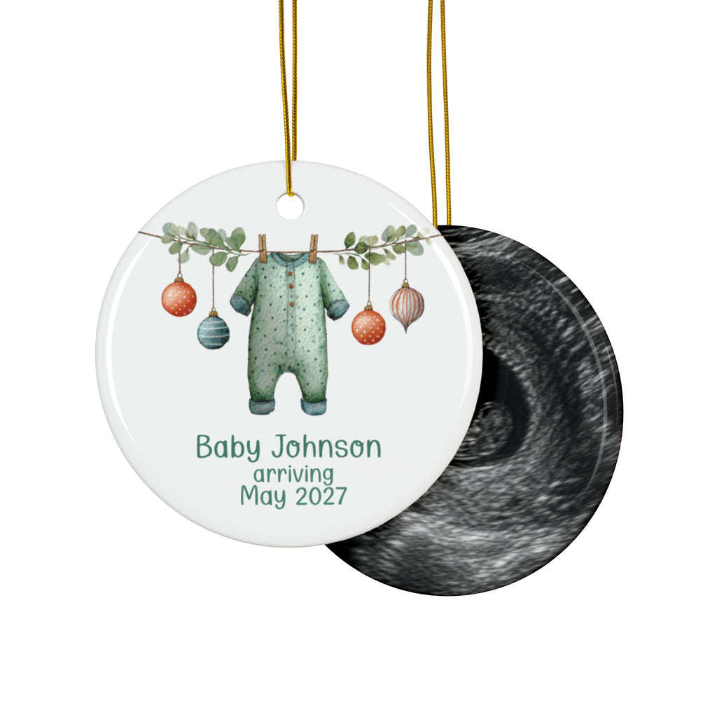 Double-sided baby arriving ornament with green polka dot sleeper on the front and an ultrasound photo on the back