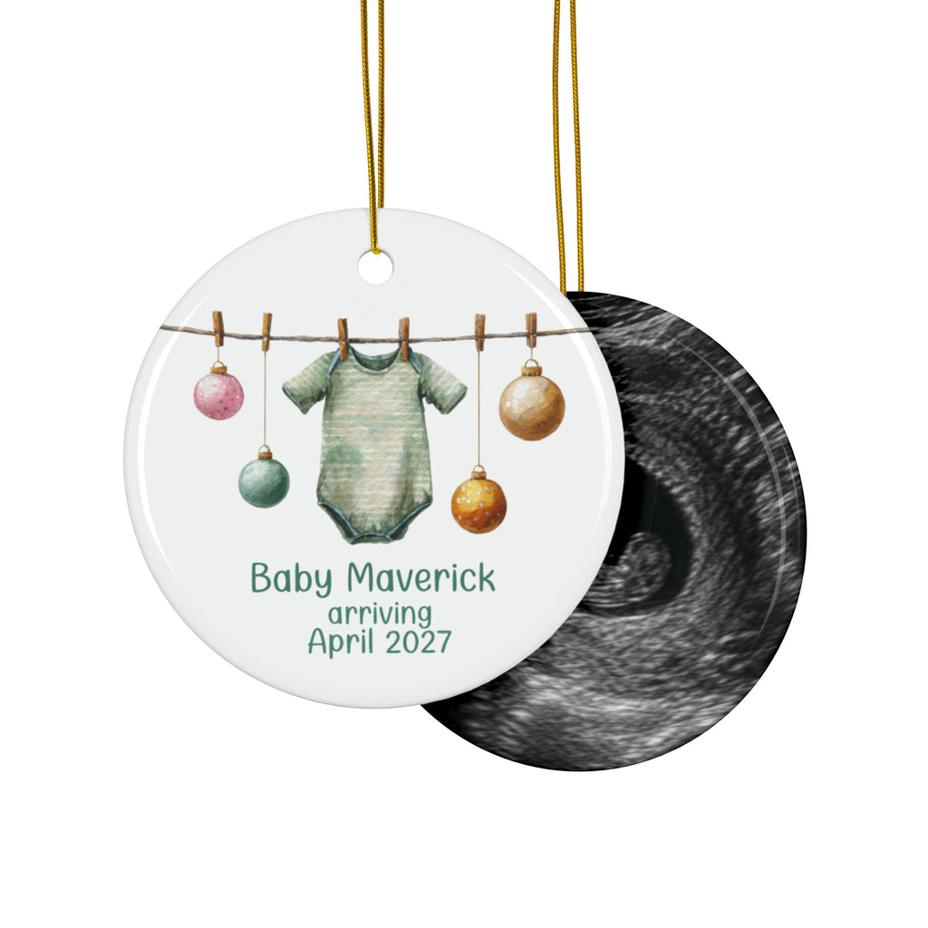 Double-sided baby arriving ornament with sage green striped bodysuit on the front and an ultrasound photo on the back