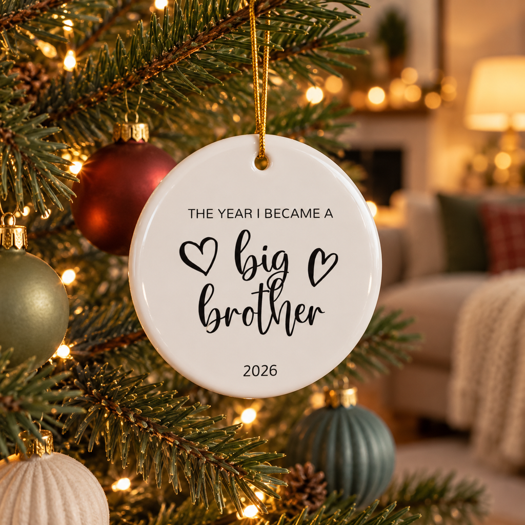Personalized The Year I Became a Big Brother Christmas ornament hanging on a Christmas tree