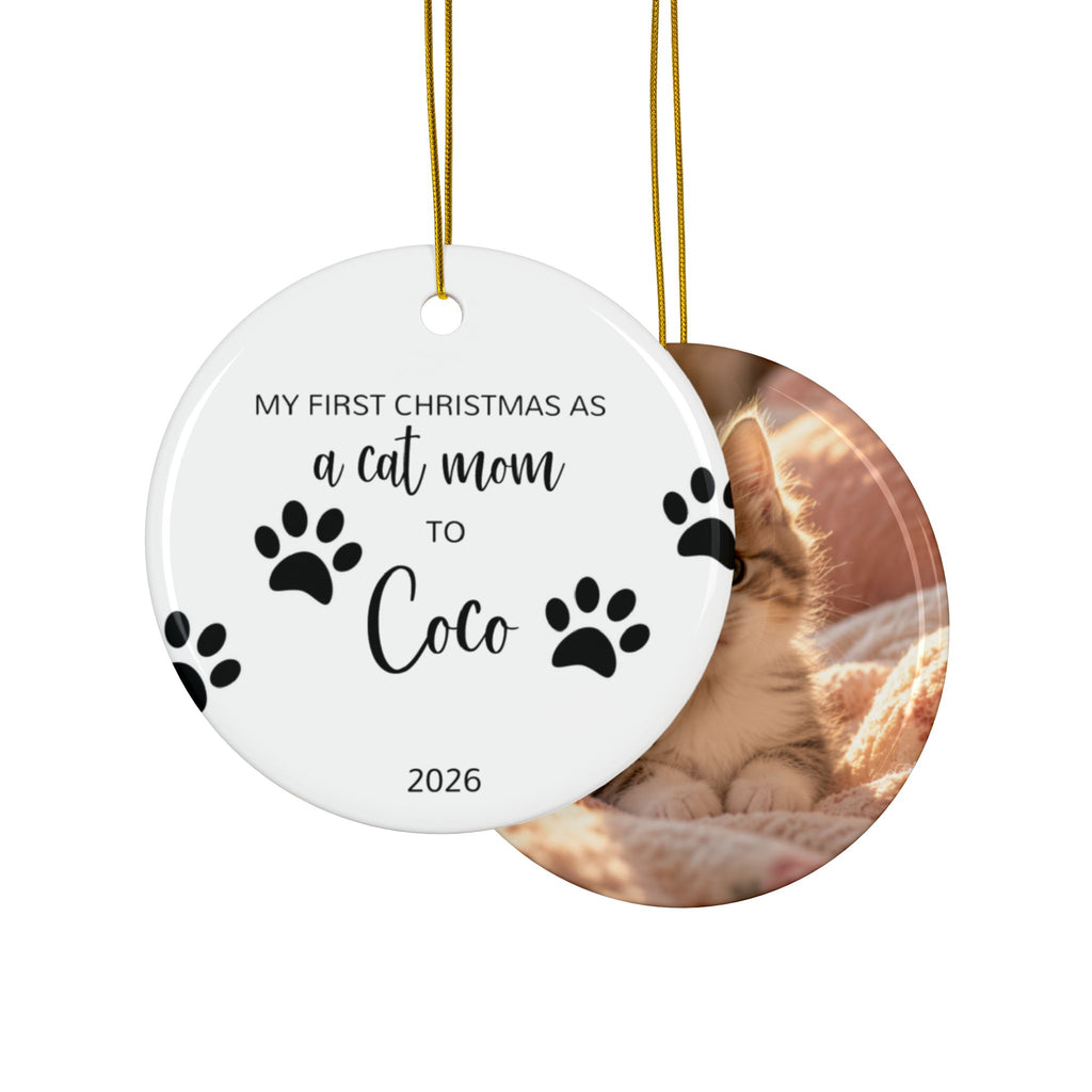 Front and back of the personalized cat mom first Christmas ornament with paw prints and black script name, design and photo side