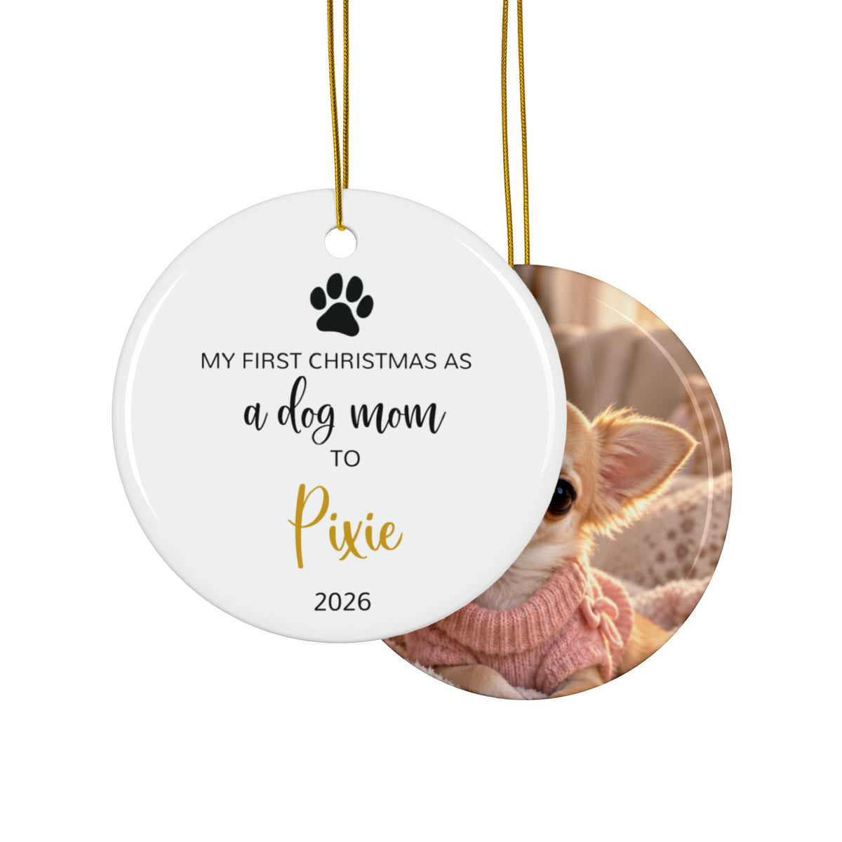 Front and back of the personalized dog mom first Christmas ornament with paw print and gold script name, design and photo side