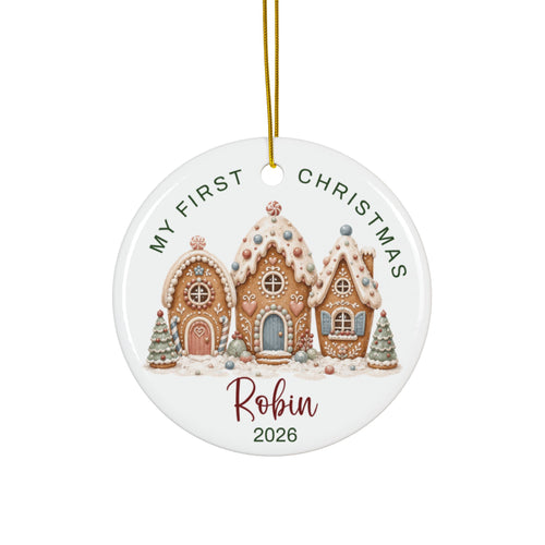 Personalized baby's first Christmas ornament with a frosted gingerbread village, baby name and 2026