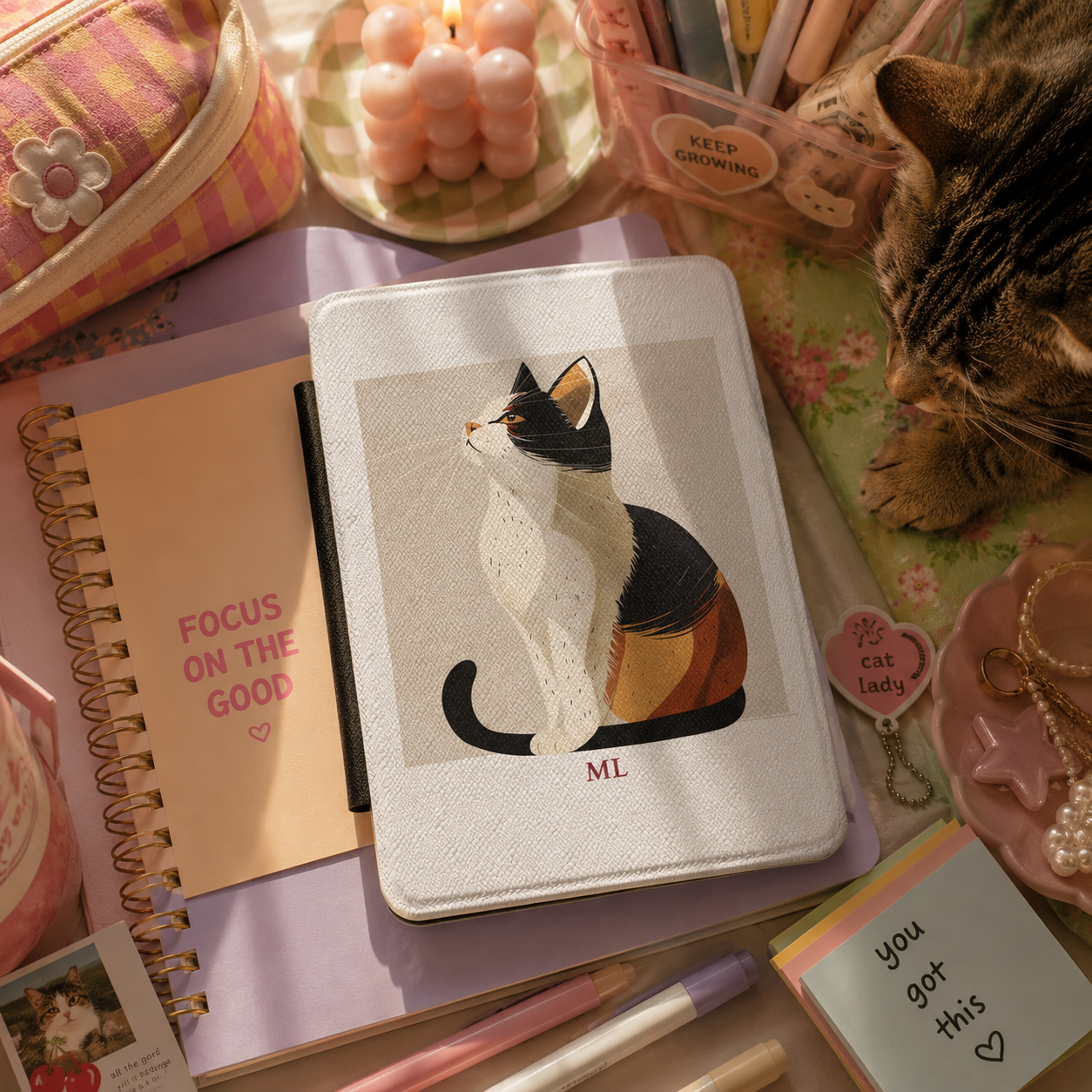Personalized calico cat profile kindle case shown in a lifestyle setting