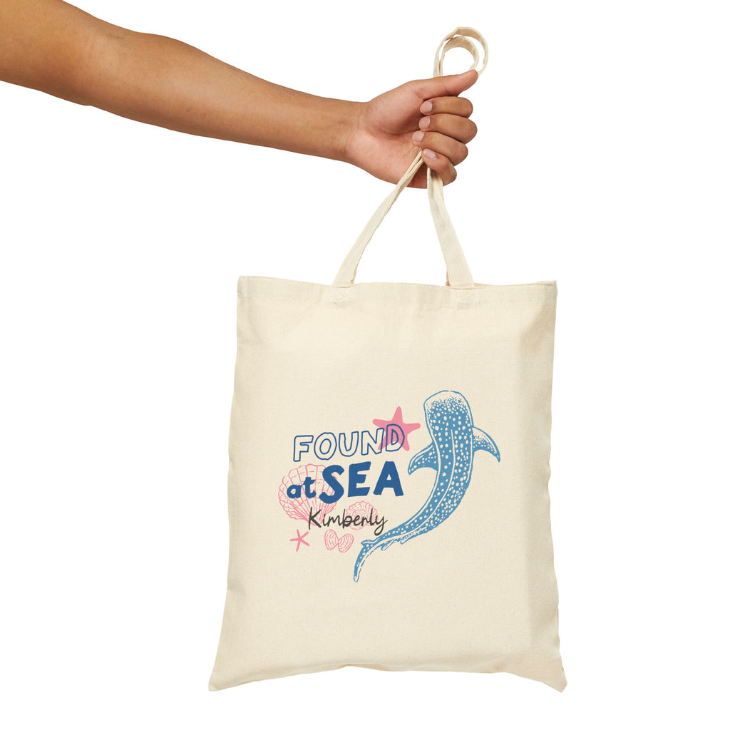 Personalized found at sea whale canvas tote bag styled in a home setting