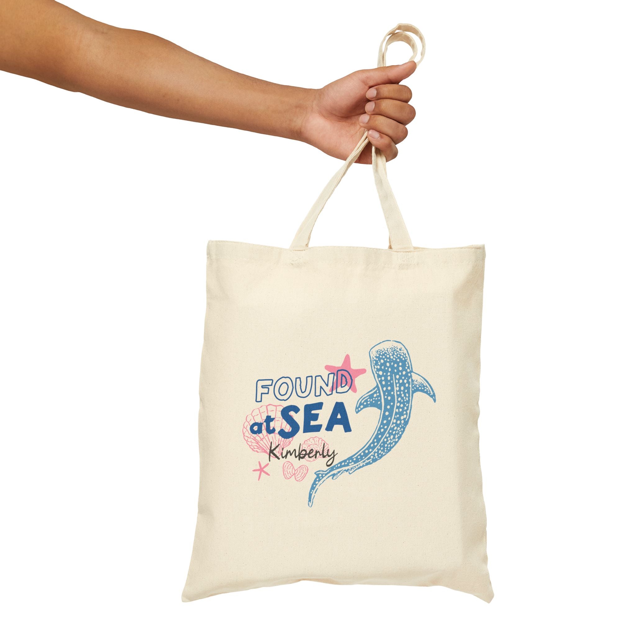 Personalized found at sea whale canvas tote bag styled in a home setting
