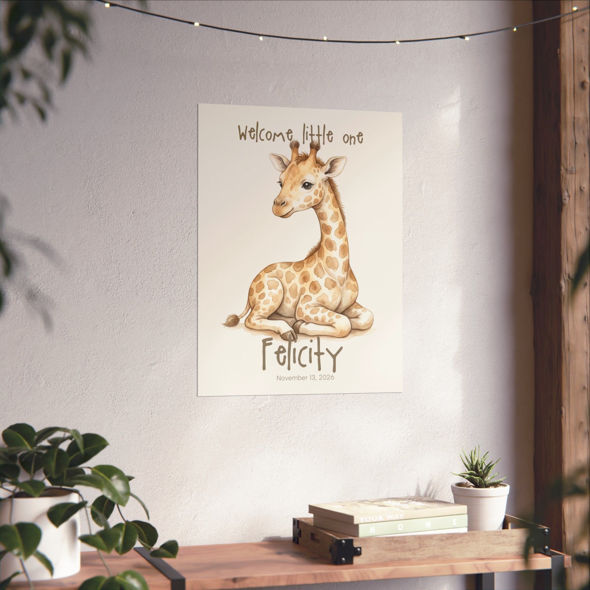 Watercolor giraffe nursery art print on wall in baby room