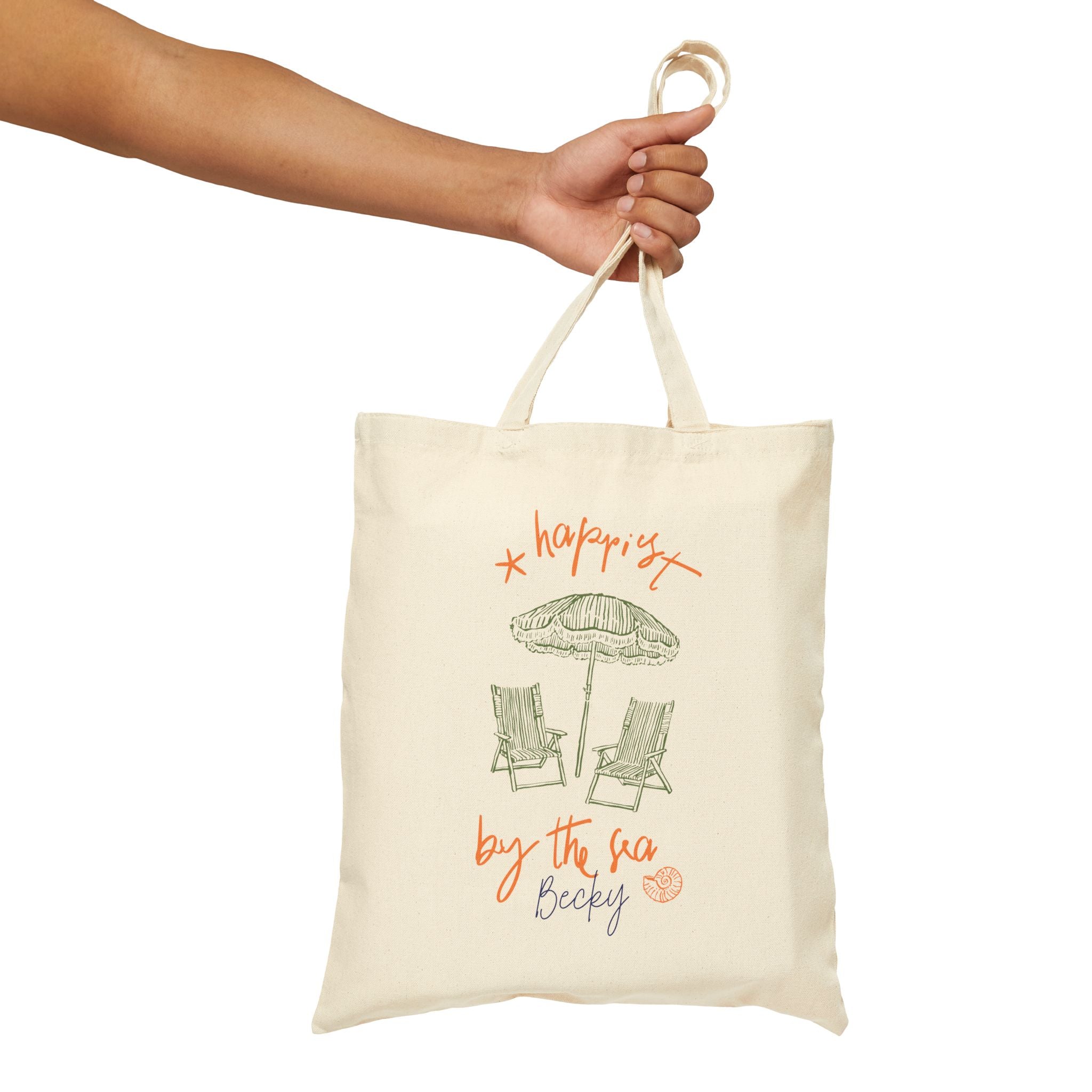 Personalized happiest by the sea canvas tote bag styled in a home setting