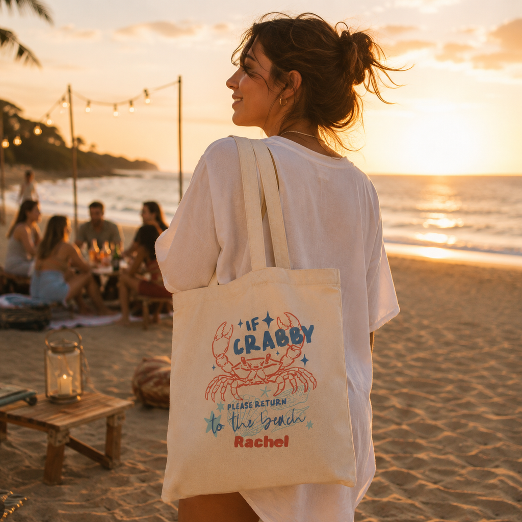 Personalized if crabby tote bag shown worn on shoulder, lifestyle photo