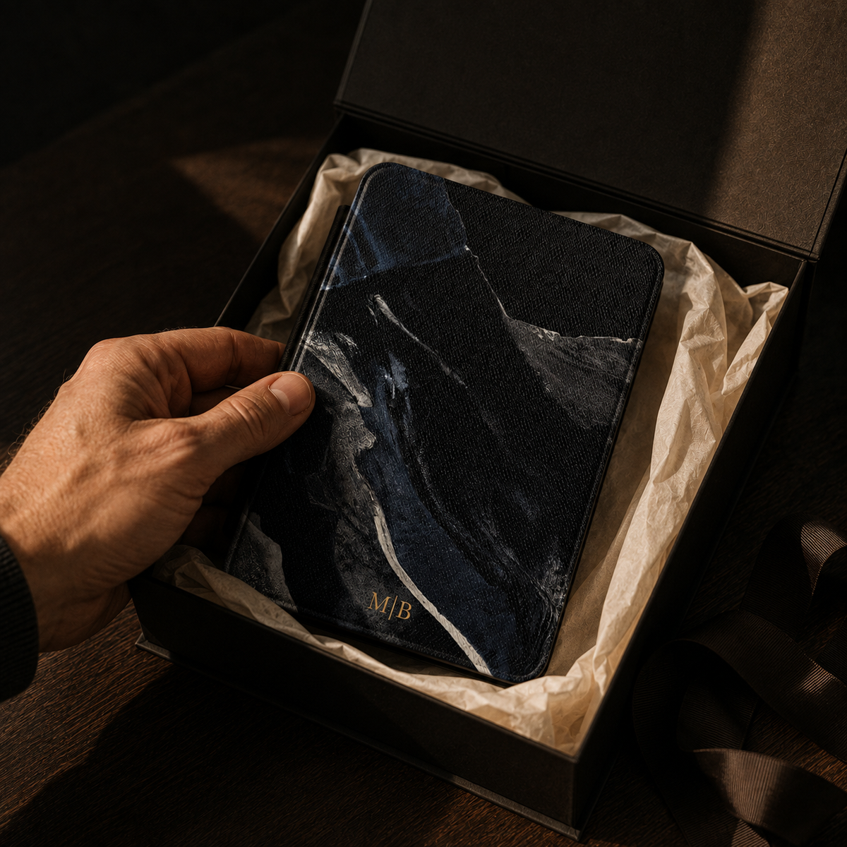 Open interior of the black marble streak Kindle case showing the fabric lining and TPU shell