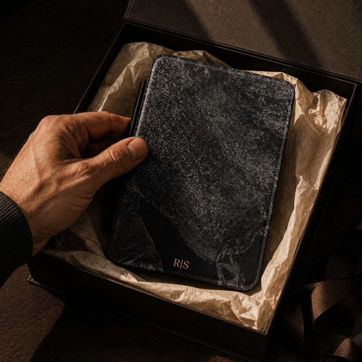 Open interior of the black stone texture Kindle case showing the fabric lining and TPU shell