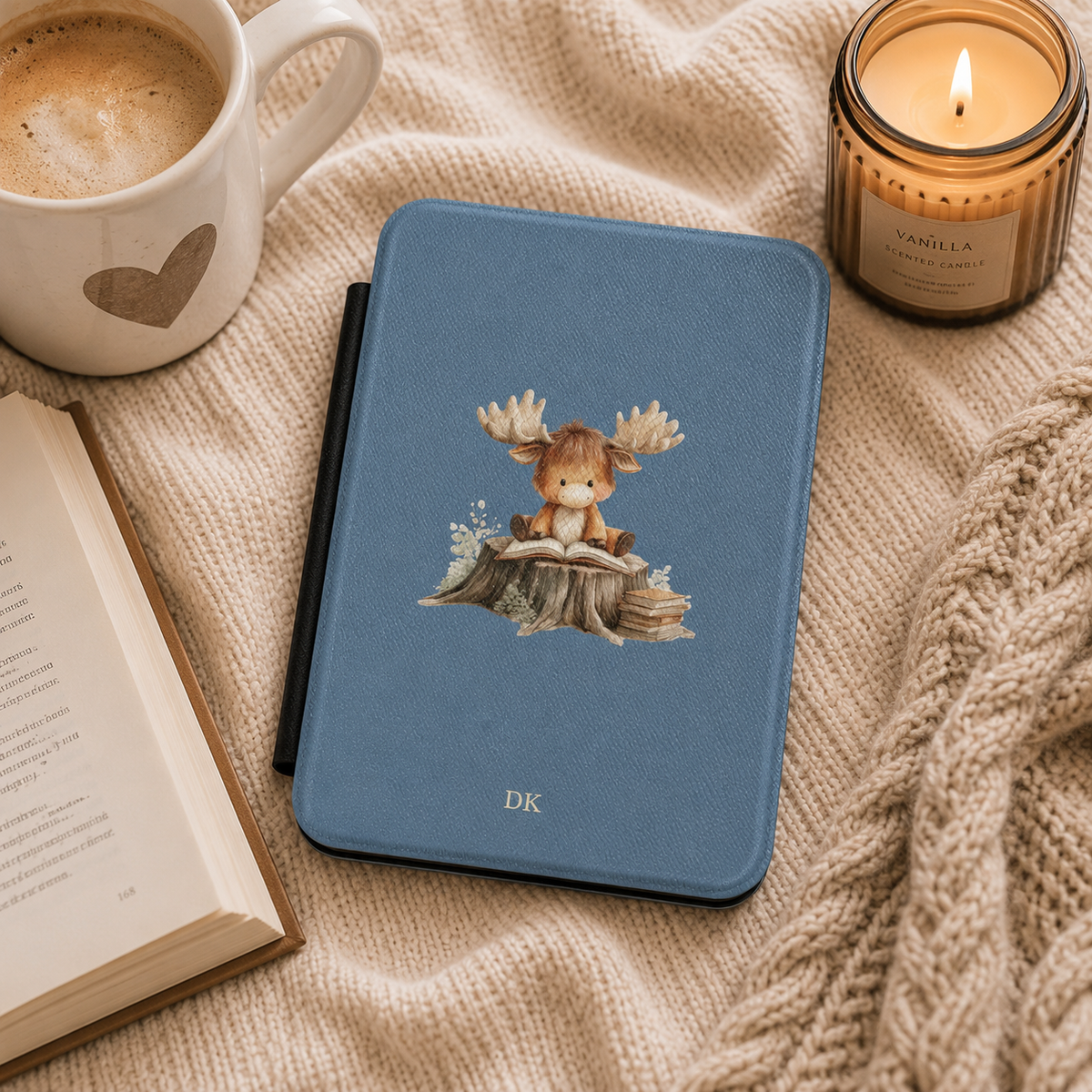 Personalized reading moose Kindle case styled in a lifestyle reading setting