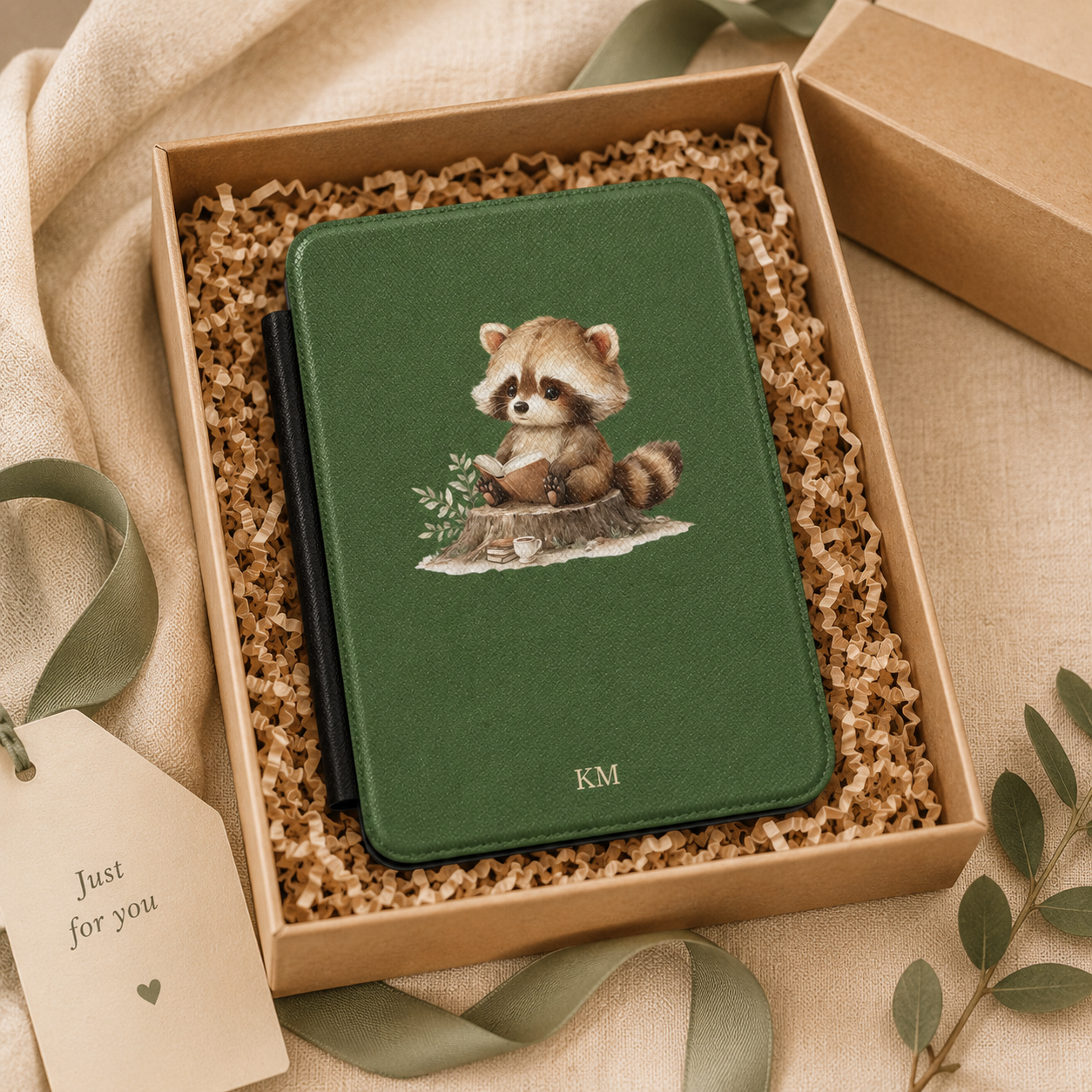 Personalized reading raccoon Kindle case shown in a gift setting