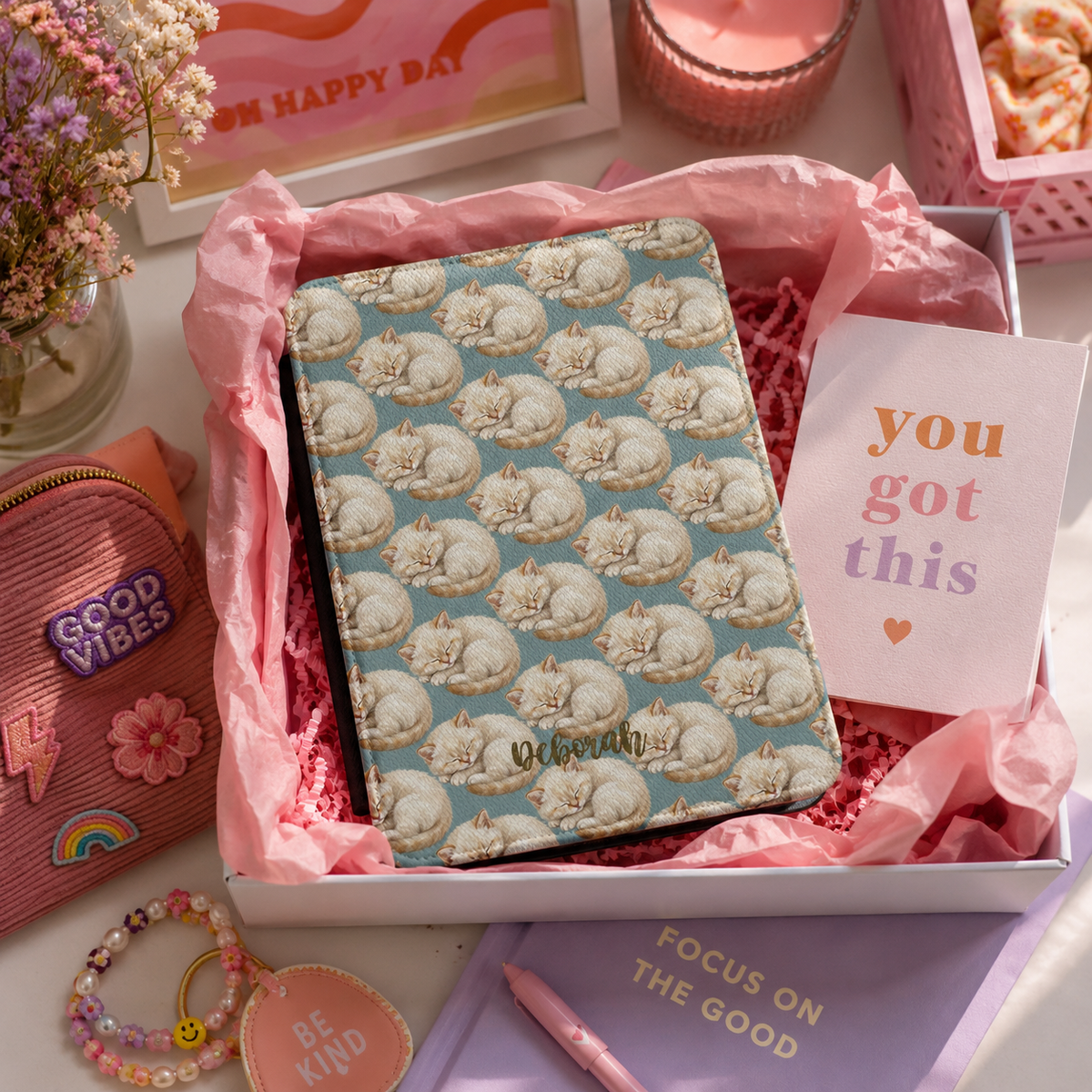 Personalized sleeping kitten Kindle case shown in a gift setting