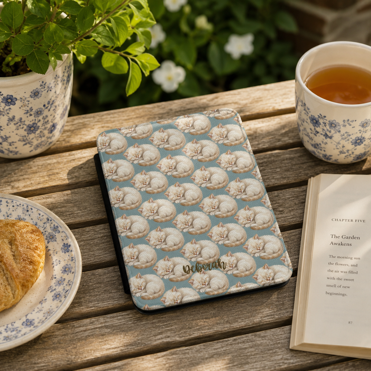 Personalized sleeping kitten Kindle case styled in a lifestyle reading setting