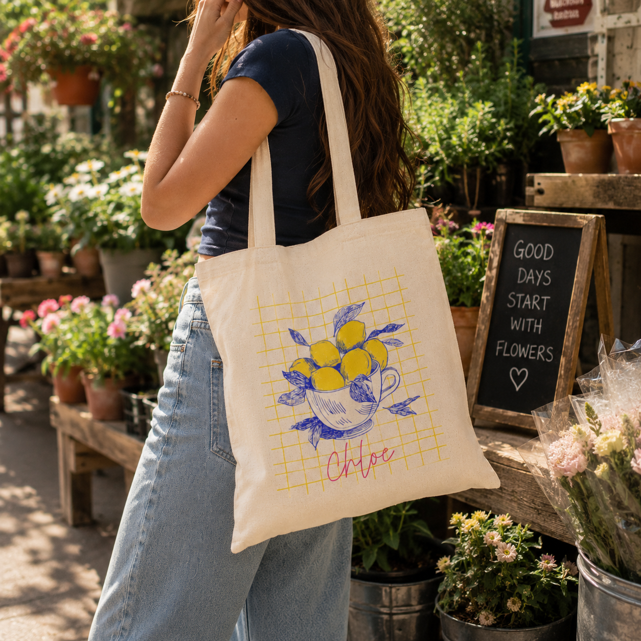 Close-up of lemon sketch print and custom name on canvas tote bag