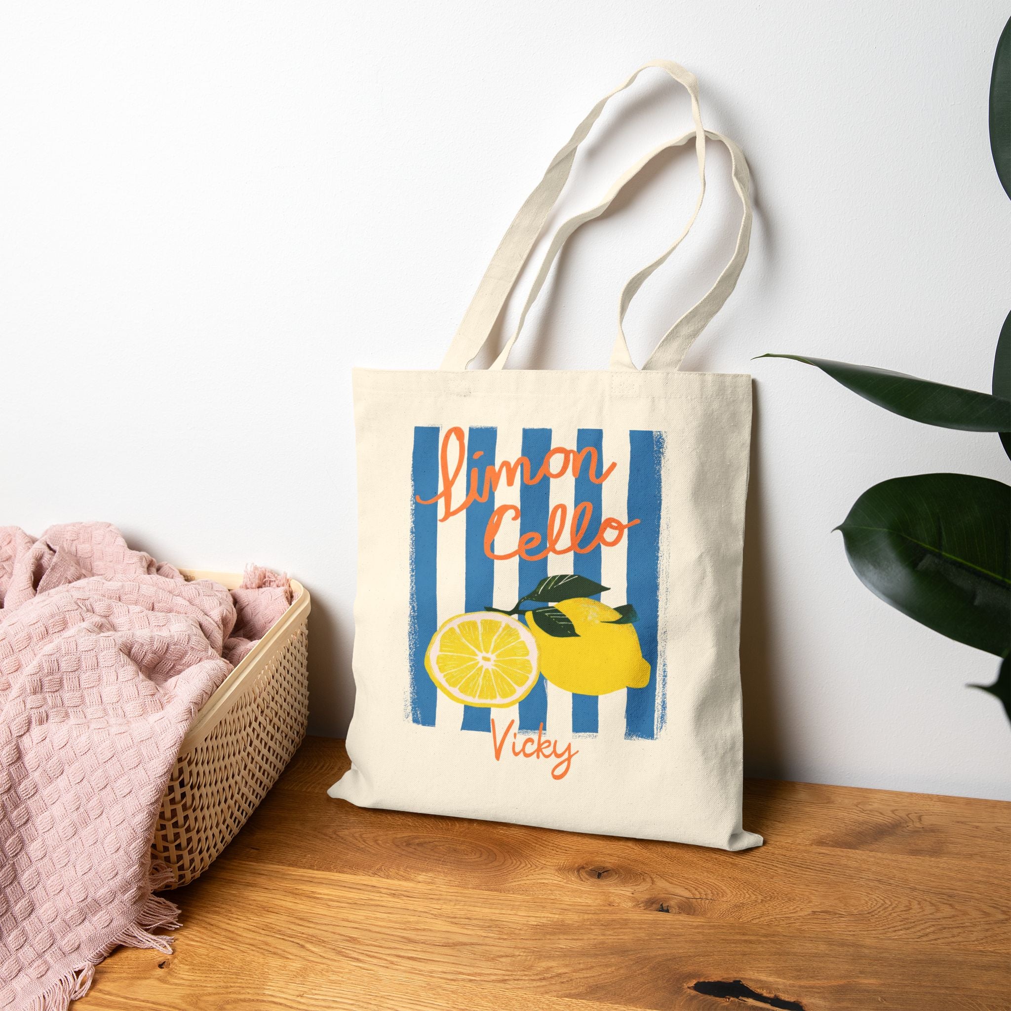 Close-up of lemon print and custom name script on canvas tote bag