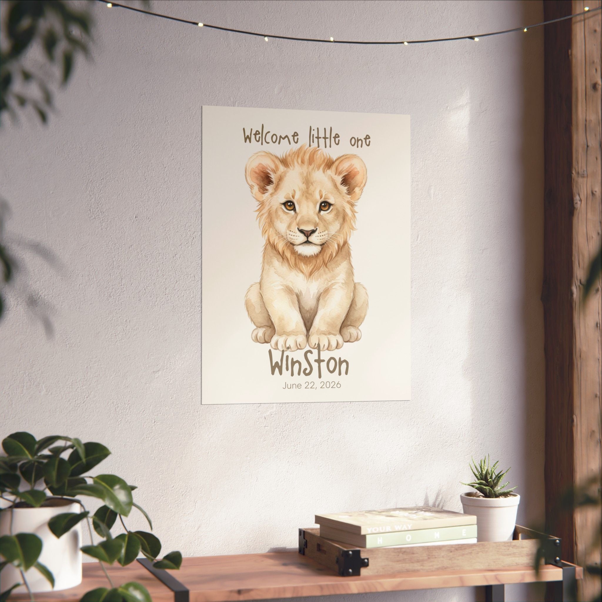 Lion cub nursery art print displayed on wall in baby room