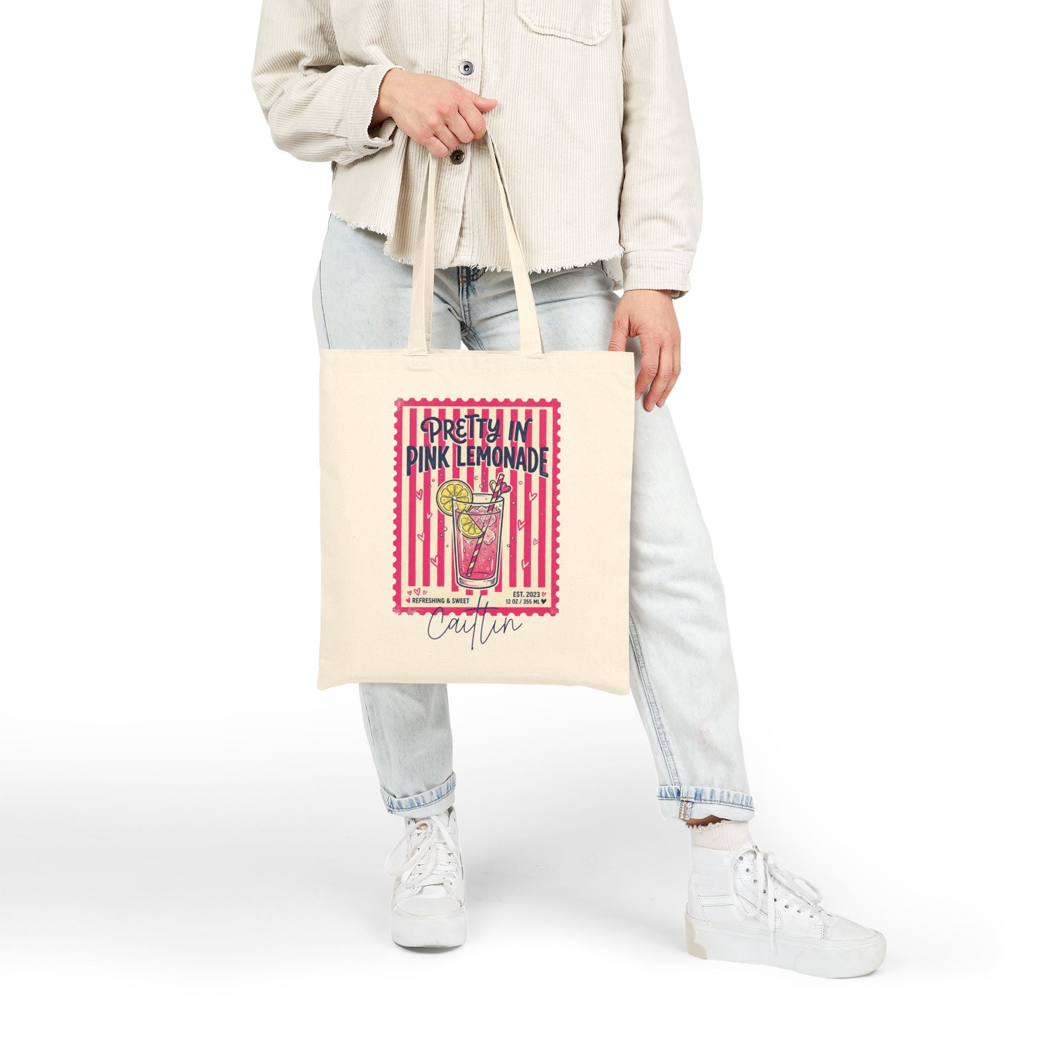 Personalized pink lemonade canvas tote bag styled in a home setting
