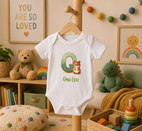 Initial Q bodysuit with quokka and name in script – flat lay