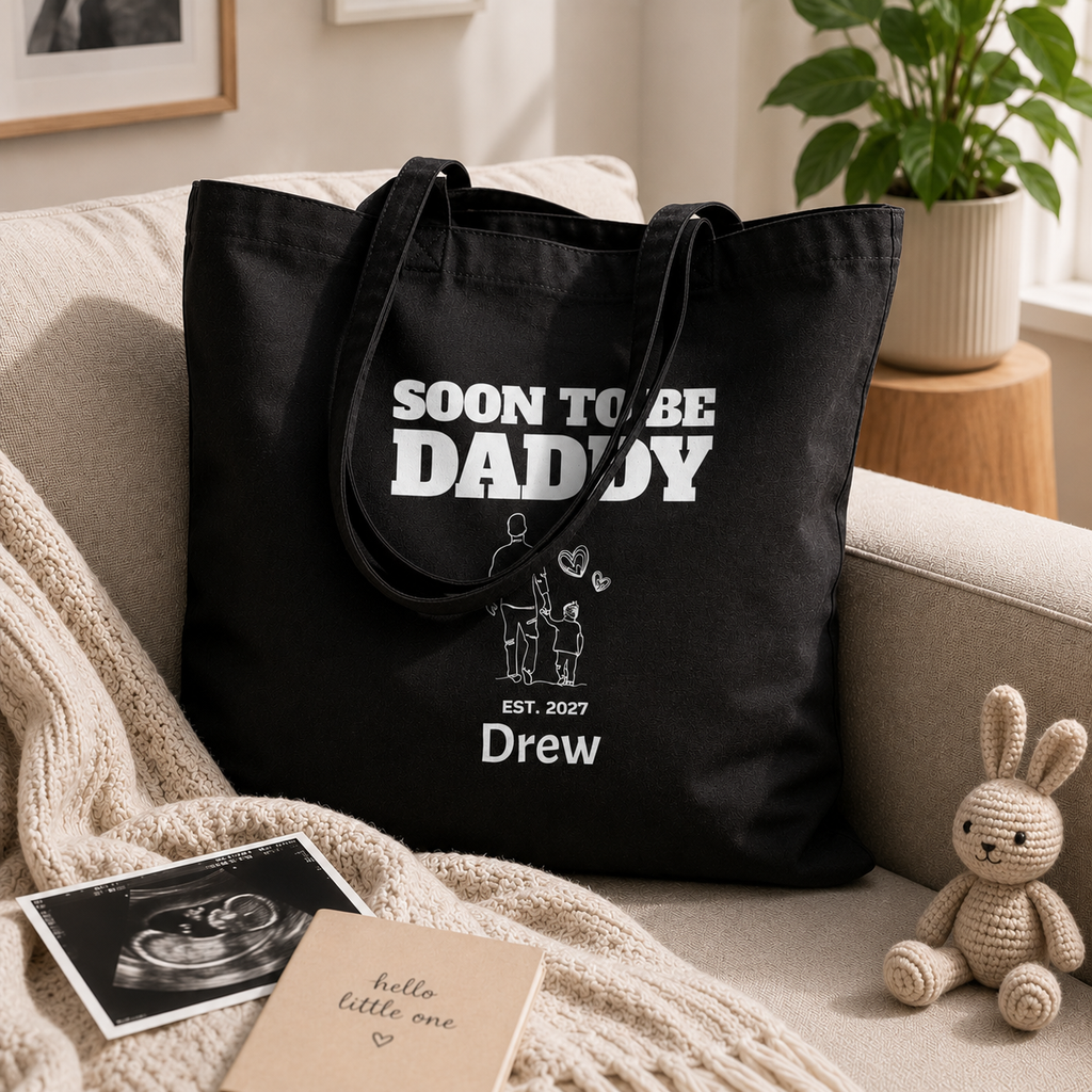 Personalized soon to be daddy tote bag shown worn on shoulder, lifestyle photo