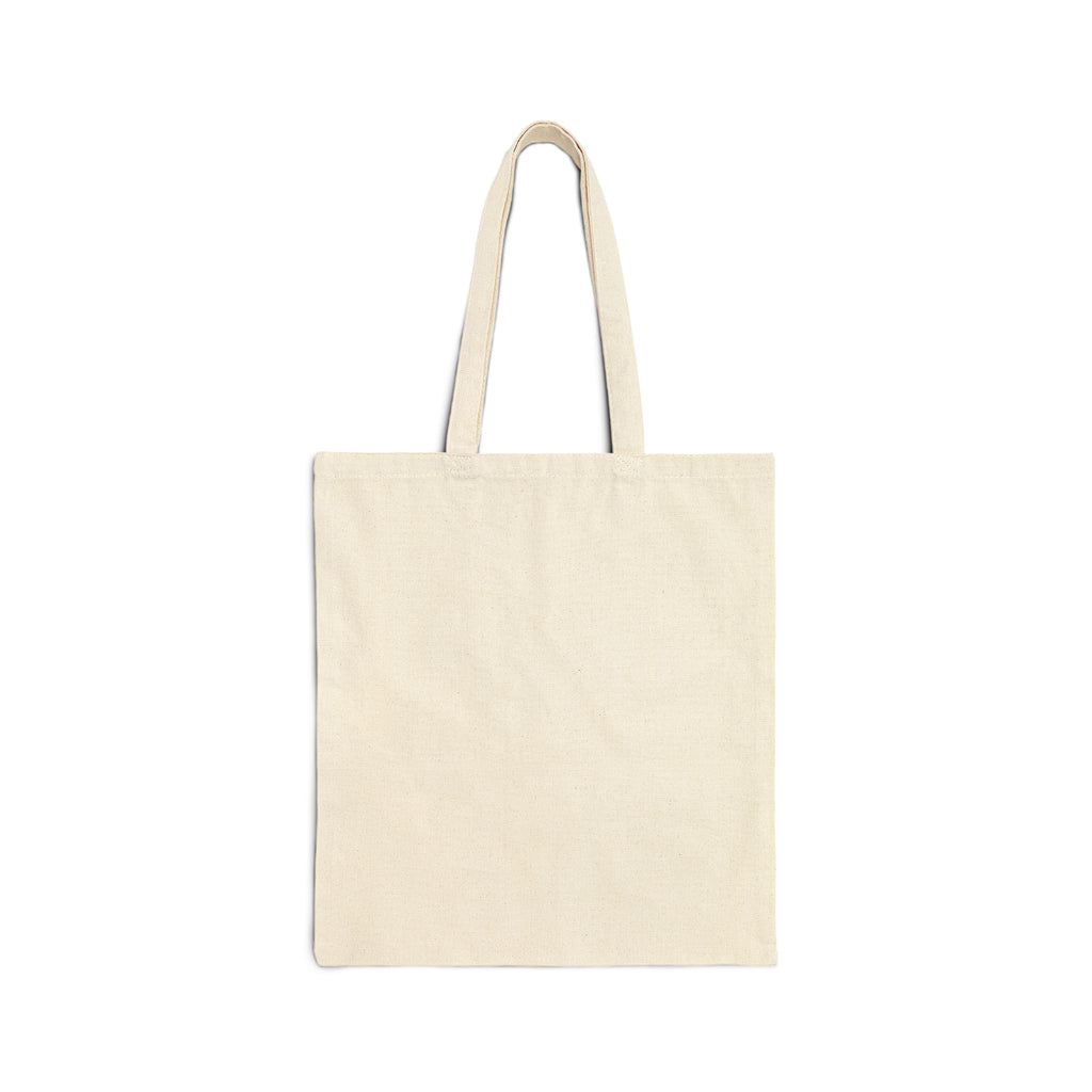 Close-up of tropical silhouette print and custom name on canvas tote bag