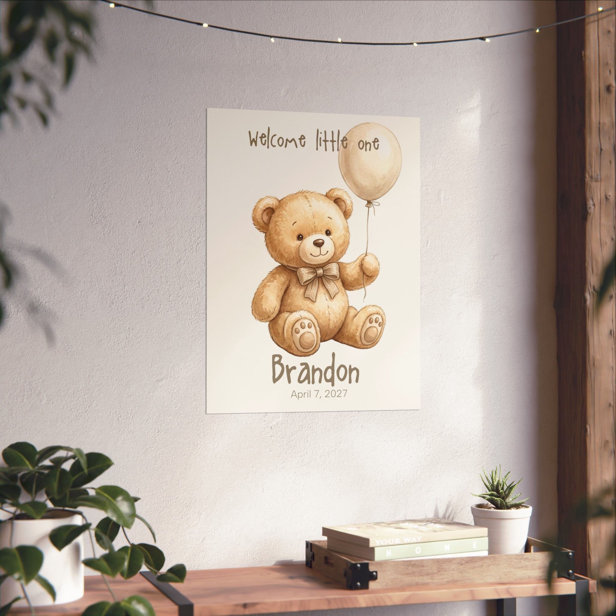 Close-up of personalized teddy bear poster showing name and birth date text