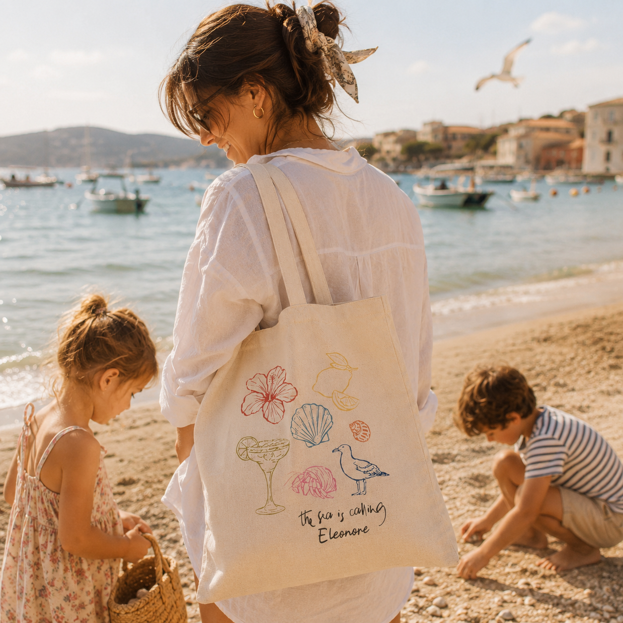 Personalized the sea is calling tote bag shown worn on shoulder, lifestyle photo